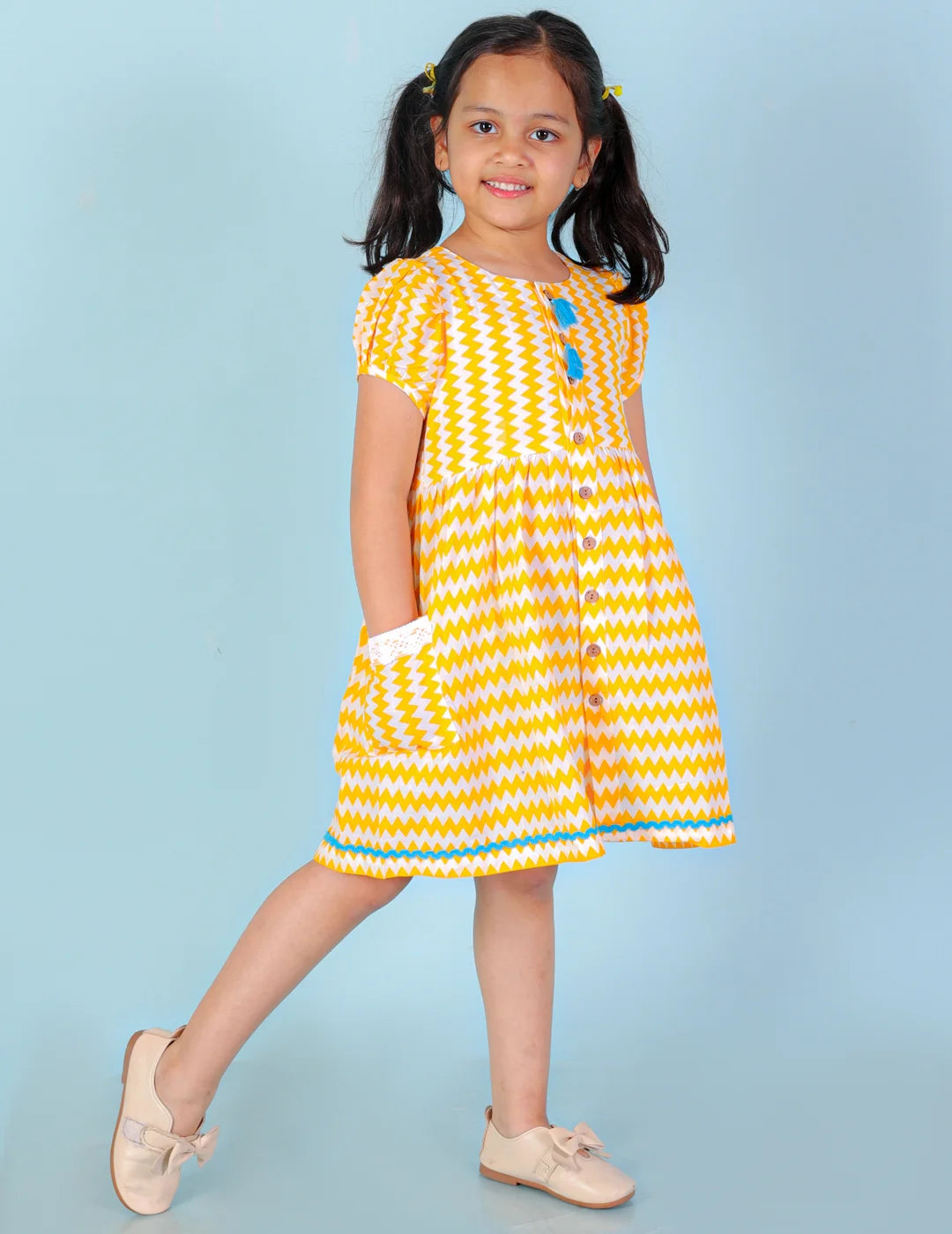 Girls printed striper cotton dress with tassles and Rick rak lace