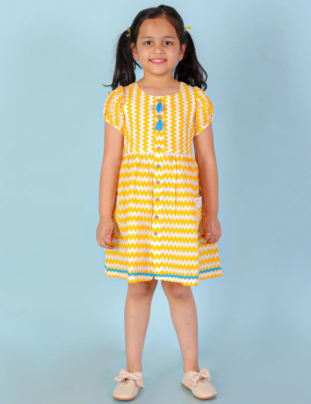 Girls printed striper cotton dress with tassles and Rick rak lace