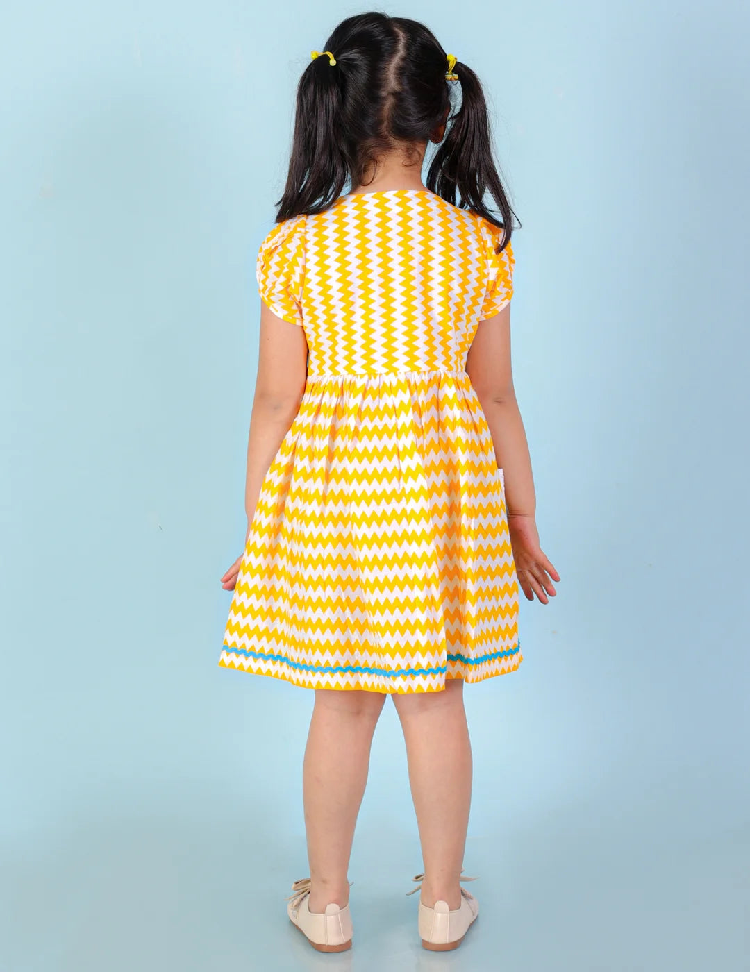 Girls printed striper cotton dress with tassles and Rick rak lace
