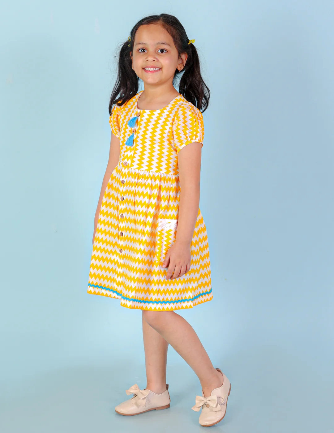 Girls printed striper cotton dress with tassles and Rick rak lace