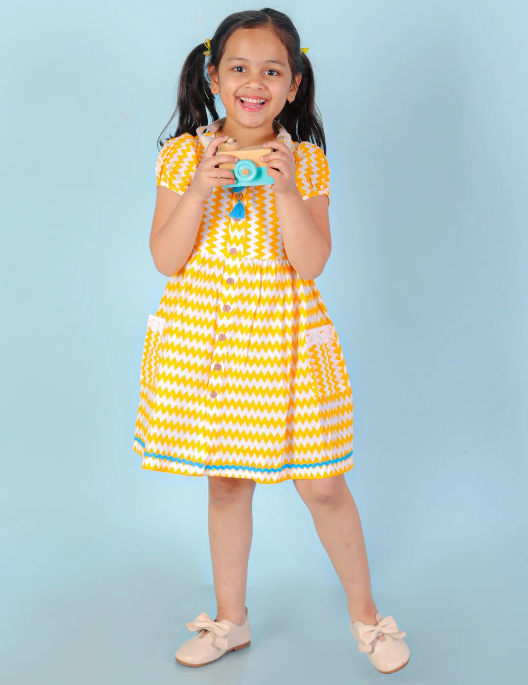 Girls printed striper cotton dress with tassles and Rick rak lace