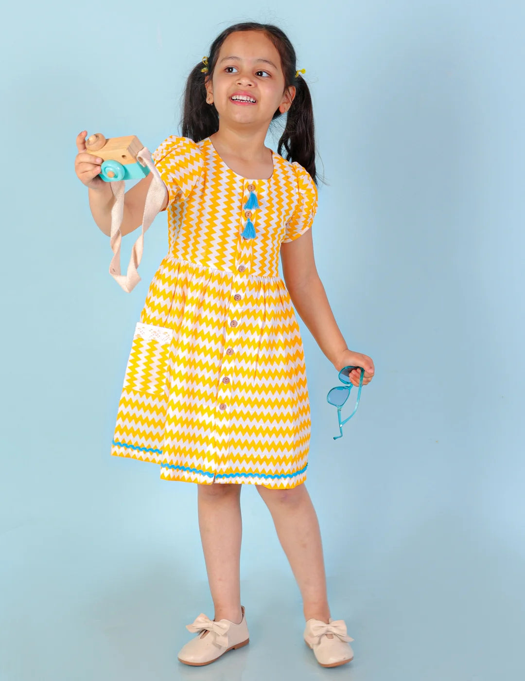 Girls printed striper cotton dress with tassles and Rick rak lace