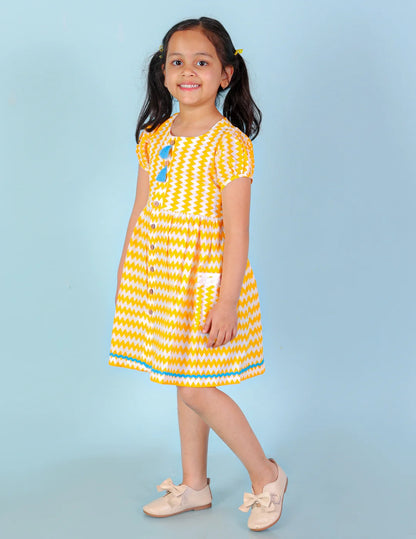 Girls printed striper cotton dress with tassles and Rick rak lace
